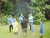 Some of the men hold forth in the back yard. Click here for full size image.