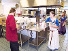 THL Thorgrimr and Lady Signy work in the kitchen. Click here for full size image.