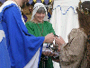 Her Majesty performs the ritual washing of hands while Bran supports the basin and Master Eldred pours. Click here for full size image.