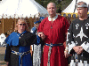 Mistress Rhiannon, Master Bran, and Baron Guillaume approach the morning's Court. Click here for full size image.
