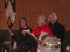 Baroness Lina Saint Albans and Duchess Simone de Barjaval look on as Mistress Alisoun (in red) reads words sent from the Midrealm Chivalry on behalf of Melisant. Click here for full size image.