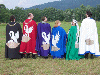 Master Oshi, Master Bran, Master Peter, Mistress Rhiannon, Mistress Susan, and Master Eldred show off their matching cloaks. Click here for full size image.